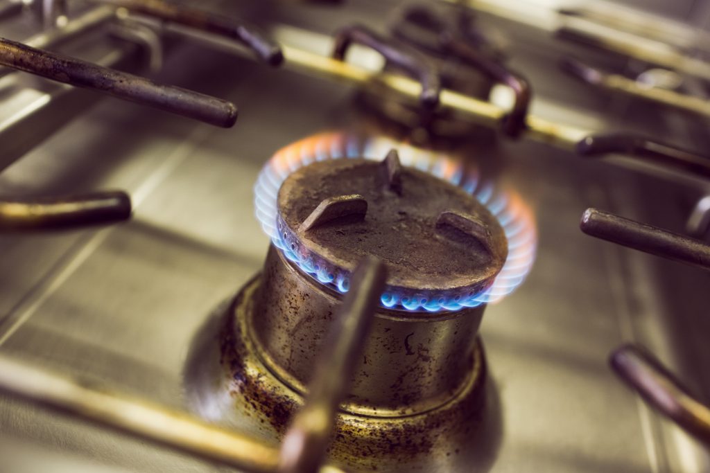 closeup of burning gas on the kitchen gas stove
